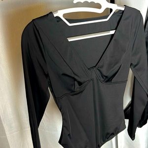 Size S  , body suit busy detail , v neck